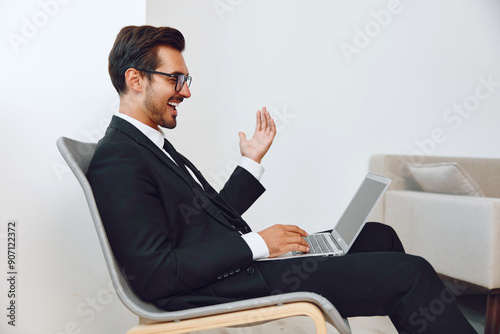 Sitting man workplace technology business happy chair winner excited laptop job businessman office executive