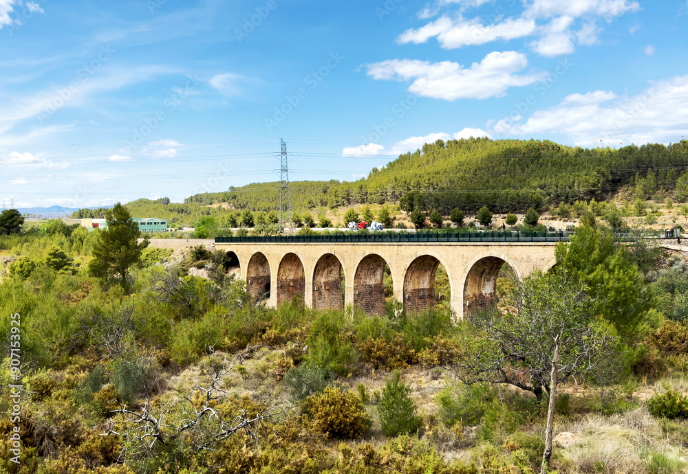 Railroad bridge near Mudejar Highway A-23 in Segorbe and Soneixa, Sot de Ferrer, Castellon Province, Valencian Community, Spain. View from Ojos Negros Greenway. Stone rail bridge. Old bridge. Railroad bridge near Mudejar Highway A-23 in Segorbe and Soneixa, Sot de Ferrer, Castellon Province, Valencian Community, Spain. View from Ojos Negros Greenway. Stone rail bridge. Old bridge.