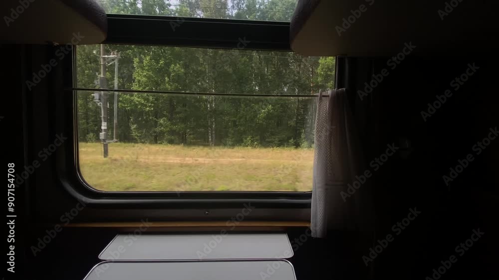 View from compartment car of a train. Landscapes in window of moving train car View from compartment car of a train. Landscapes in window of moving train car