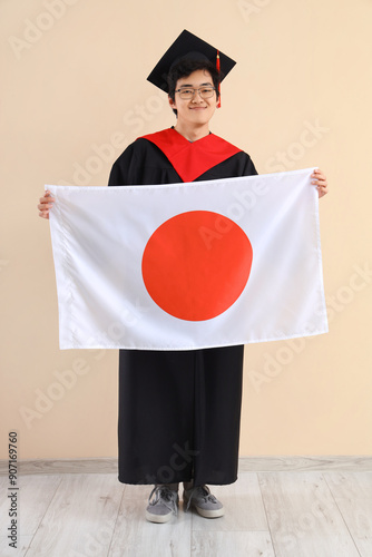 Male Asian graduate with fl...