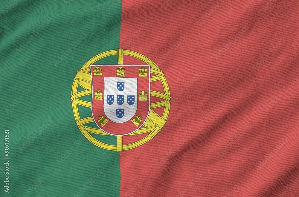 Portugal flag depicted on folded wavy fabric of old cloth close up Portugal flag depicted on folded wavy fabric of old cloth close up