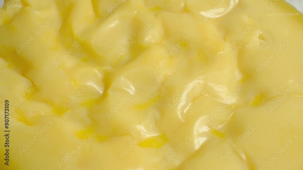 Cutting gruyere cheese with a knife in close-up Cutting gruyere cheese with a knife in close-up