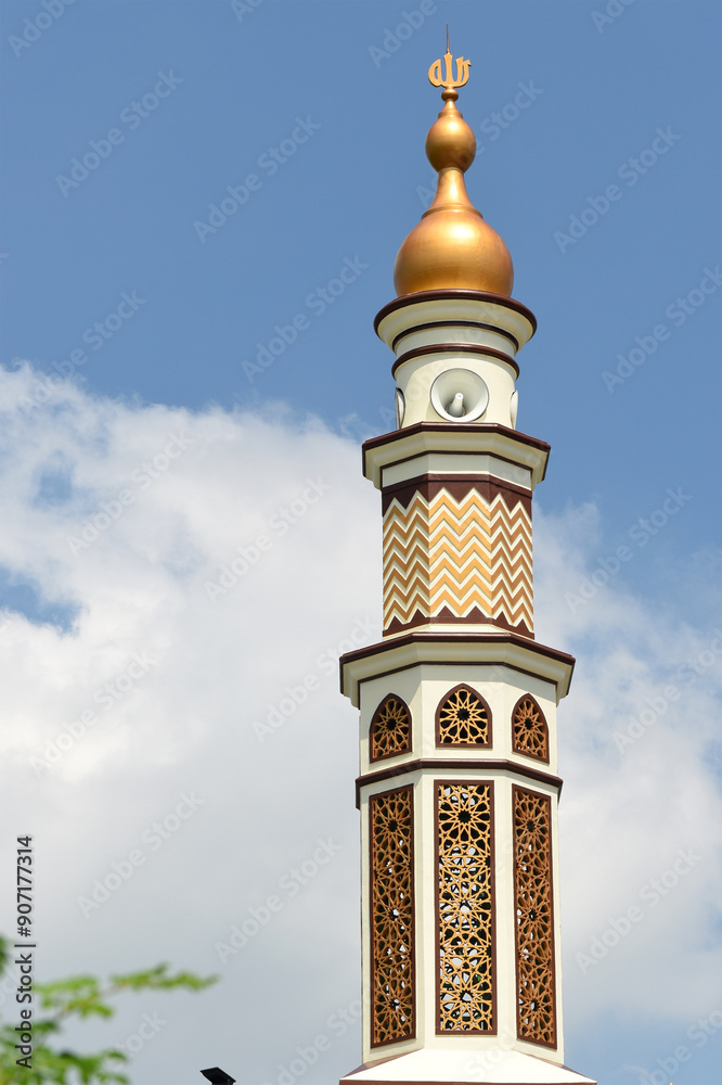 Beautiful white gold mosque minaret with some loudspeakers Beautiful white gold mosque minaret with some loudspeakers