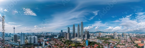 Panoramic view of modern cityscape with skyscrapers, buildings, and blue sky in Kuala Lumpur, Malaysia. Concept of urban development, travel, and tourism.