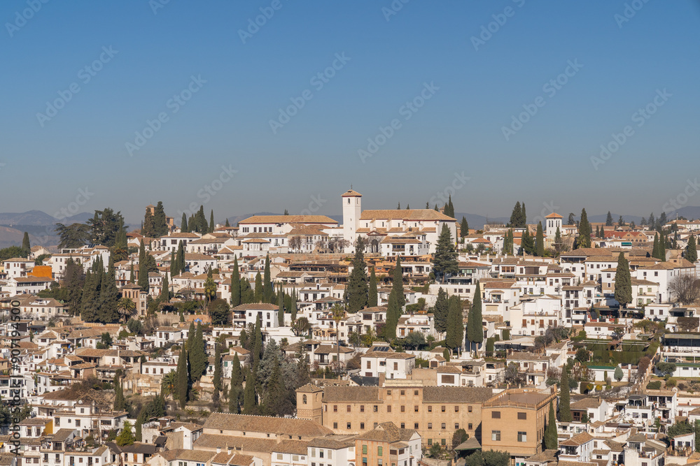 San Pedro neighborhood in the city of Granada, Spain on a sunny day with blue sky in the background San Pedro neighborhood in the city of Granada, Spain on a sunny day with blue sky in the background