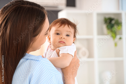 Mother with her little baby at home, closeup