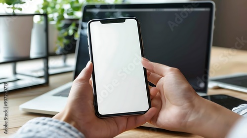 Mockup of a Smartphone in Hands on a Desk