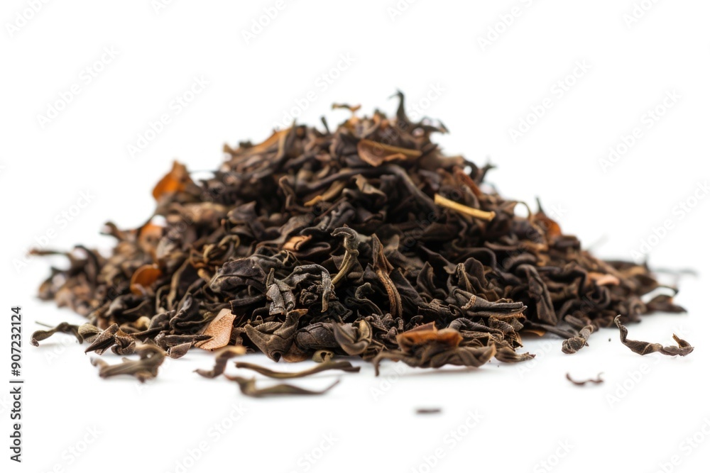 A collection of dried tea leaves arranged on a clean white surface A collection of dried tea leaves arranged on a clean white surface