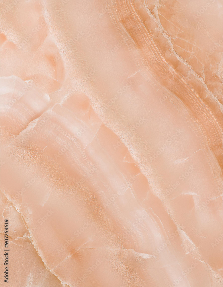 Fototapeta premium Closeup of a peach colored marble texture with natural veins and patterns