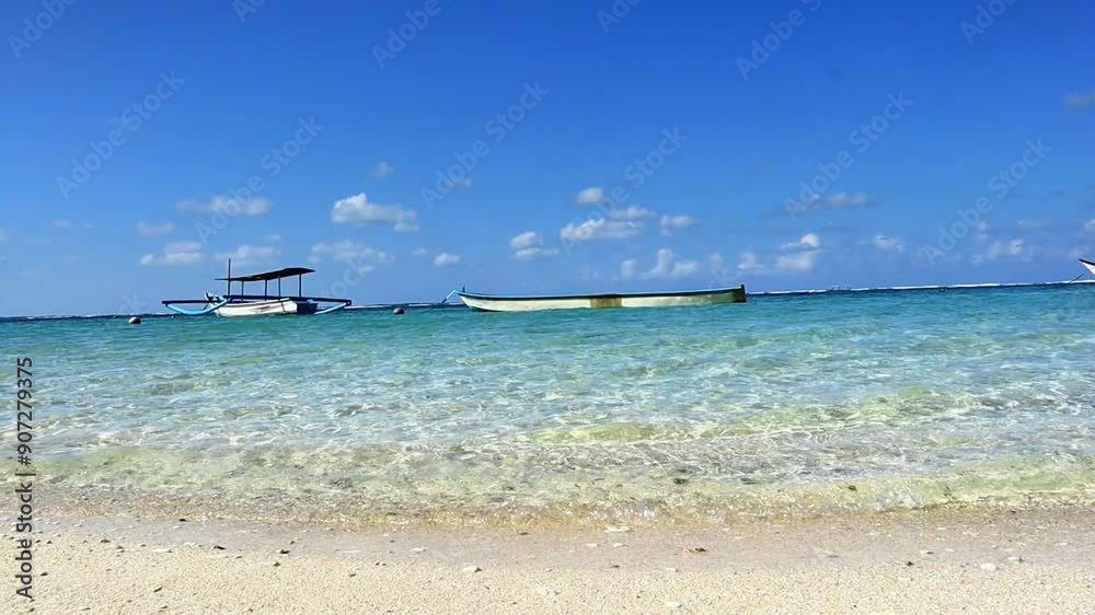 Fishing boats moored on a serene blue beach, surrounded by turquoise water and white sandy beaches, capturing a serene coastal lifestyle and marine beauty. Fishing boats moored on a serene blue beach, surrounded by turquoise water and white sandy beaches, capturing a serene coastal lifestyle and marine beauty.