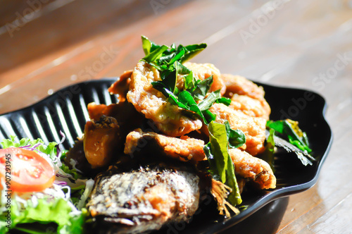 Fotografie sliced fish or fried fish , fried tilapia fish