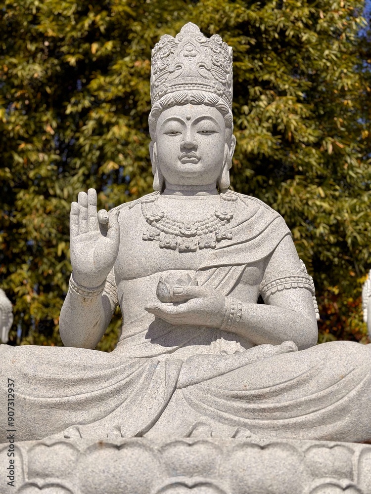 statue of buddha-holding cup