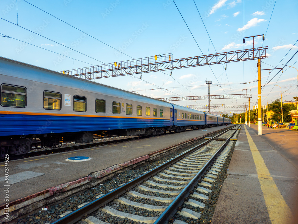 Railway tracks. Train on the tracks. Station, platform. Train cars. Train ride. Railway tracks. Train on the tracks. Station, platform. Train cars. Train ride.