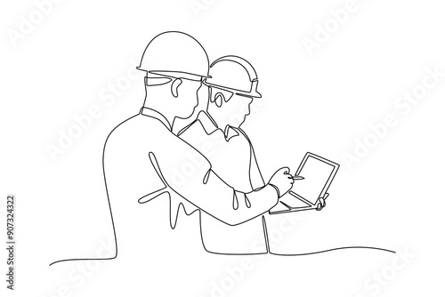 construction worker looking at work tablet. Labor Day