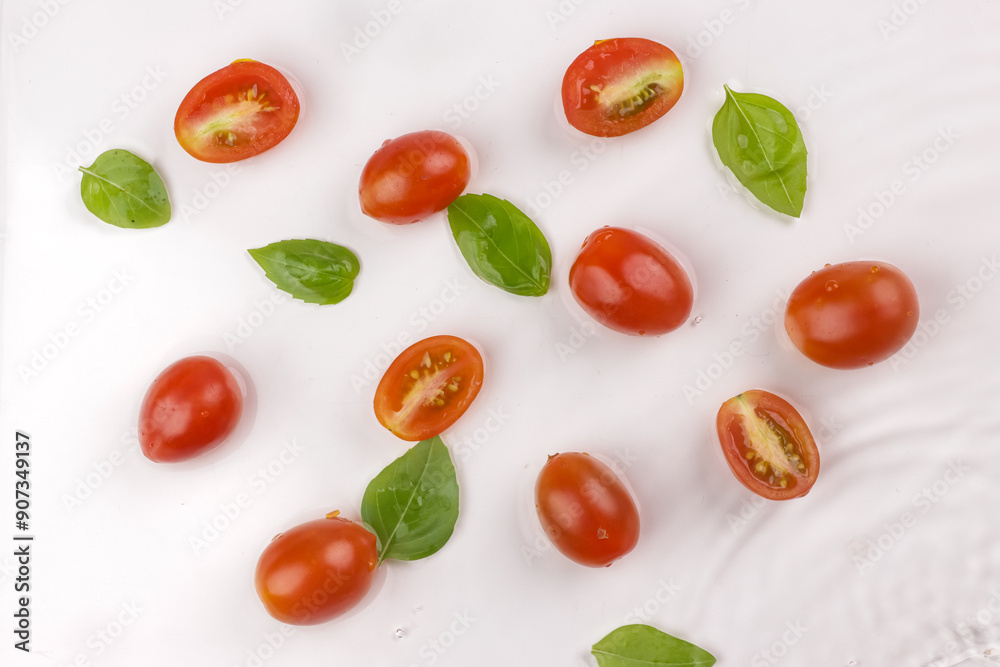 Cherry Tomatoes and Basil Leaves. Cherry Tomatoes and Basil Leaves.