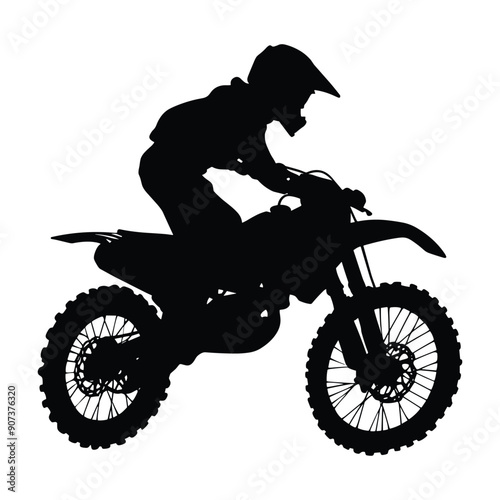 Silhouette of a motocross rider on a dirt bike. 