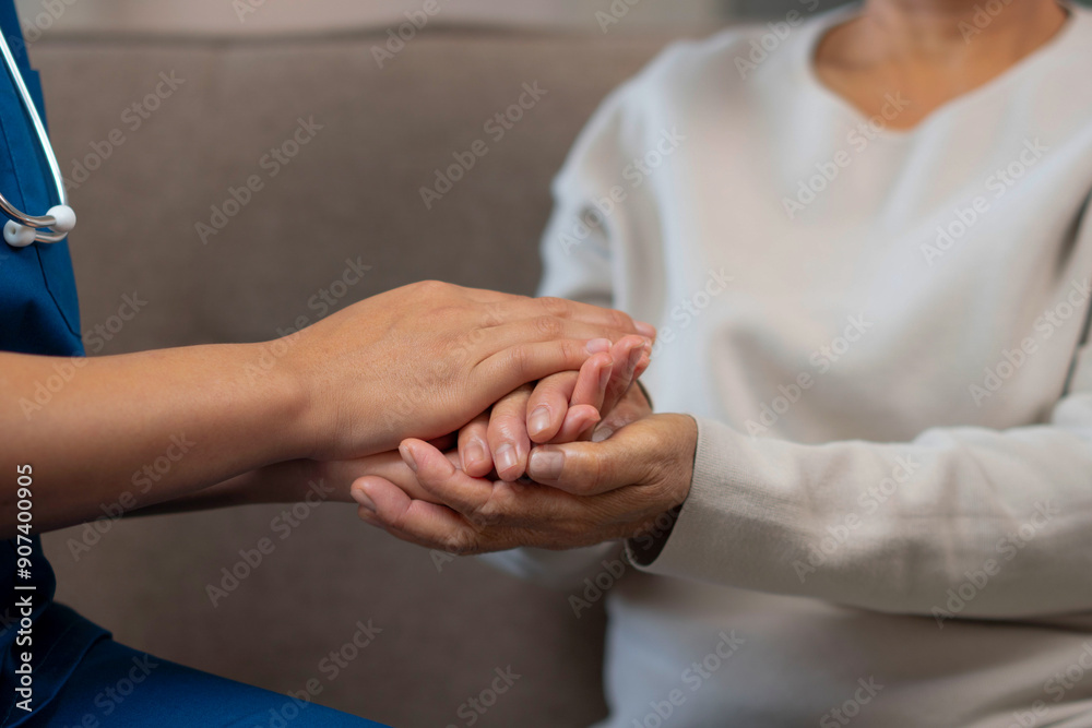 A female nurse caregiver holds hands to encourage and comfort an people of retirement age Caregiver helping elderly woman provides medical advice A female nurse caregiver holds hands to encourage and comfort an people of retirement age Caregiver helping elderly woman provides medical advice