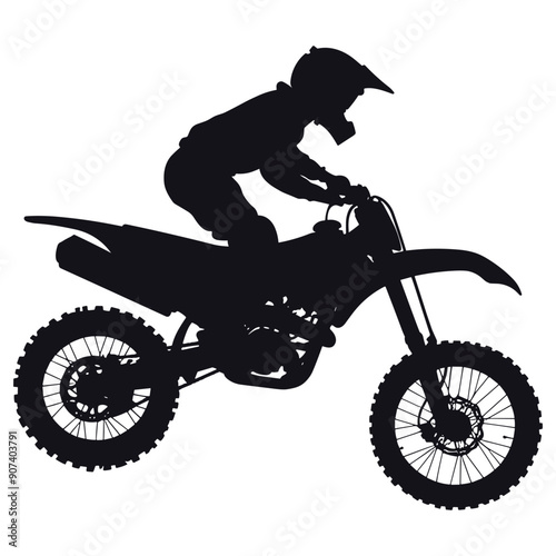 Silhouette of a motocross rider on a dirt bike. 
