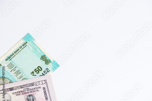 US dollar and Indian currency exchange rate. Close-up of US dollar and Indian paper currency