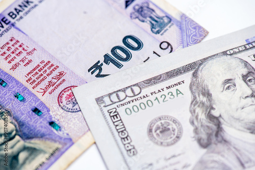 US dollar and Indian currency exchange rate. Close-up of US dollar and Indian currency. photo