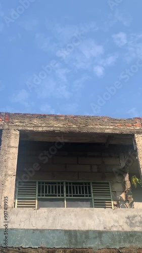 Unfinished house building with cloudy sky background photo