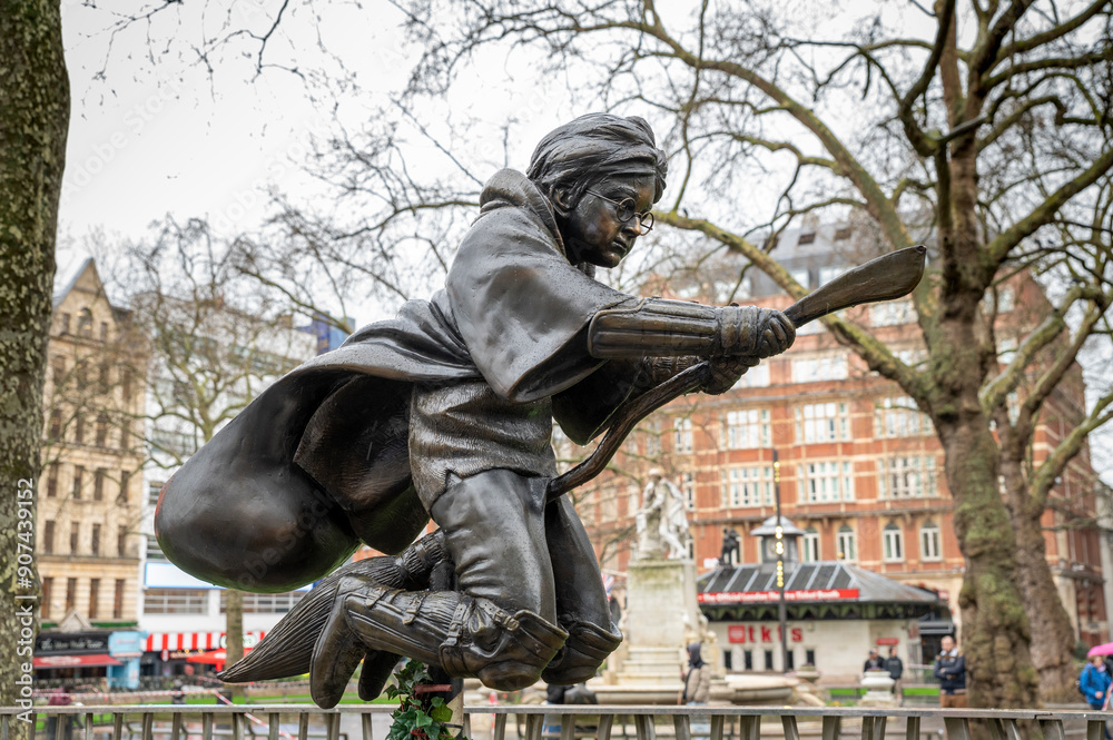 Naklejka premium London, UK - March 22, 2024 : A statue of Harry Potter. Monument of Daniel Radcliffe by Alex Zane. Leicester Square, London, UK.