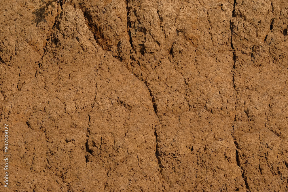 The surface of the dry land is covered with abstract patterns, shapes and textures. Excavated land. The soil looks fragile and is prone to landslides The surface of the dry land is covered with abstract patterns, shapes and textures. Excavated land. The soil looks fragile and is prone to landslides