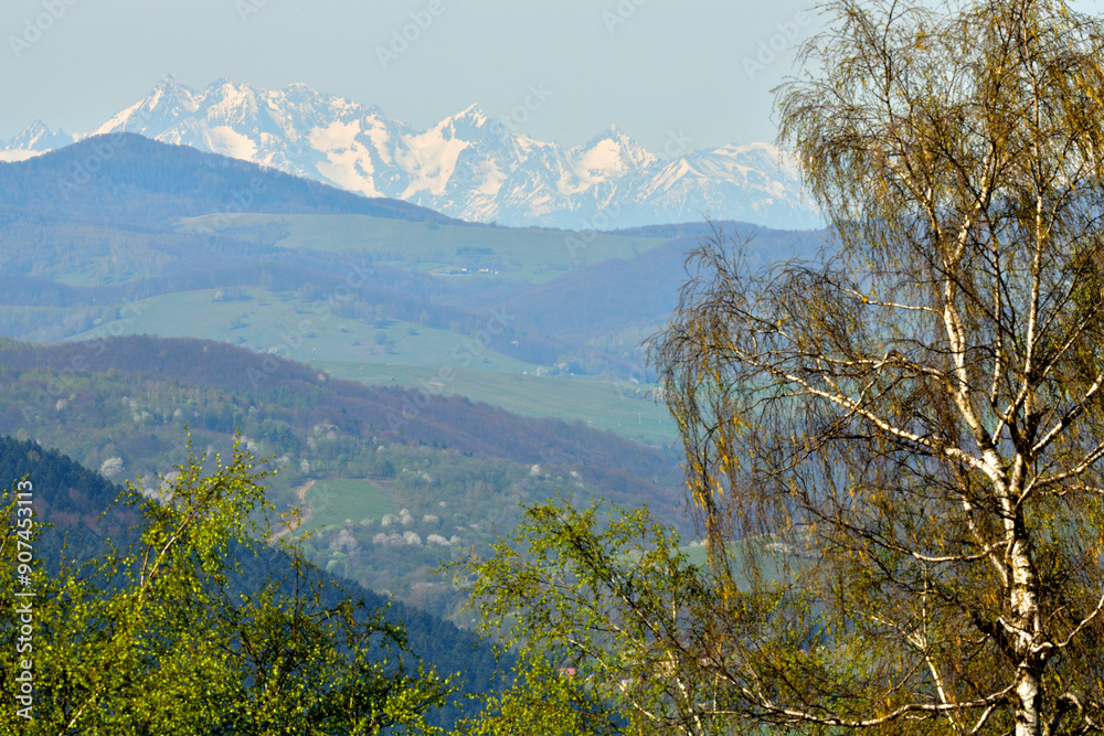 Surrounding valleys and mountains and view from of the high peaks of snow-capped mountains