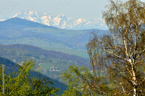 Obraz na płótnie Surrounding valleys and mountains and view from of the high peaks of snow-capped mountains w salonie