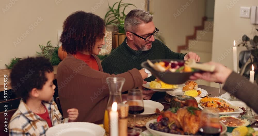 Food, happy family and serving dinner in home for thanksgiving celebration at night. Child, mom and dad share meal, corn or eating healthy vegetables in plate with interracial people bonding together