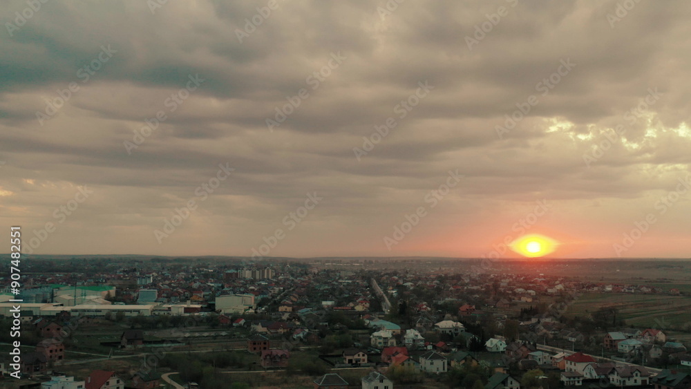 Beautiful sunset on the outskirts of the city from a drone. Sunset from a bird's eye view. Beautiful sunset on the outskirts of the city from a drone. Sunset from a bird's eye view.