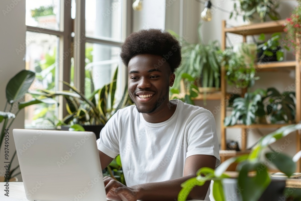 Happy young black man using laptop computer for online work at table in home office, . Cool African American guy having remote job, freelancing on web. Modern business, Generative AI Happy young black man using laptop computer for online work at table in home office, . Cool African American guy having remote job, freelancing on web. Modern business, Generative AI