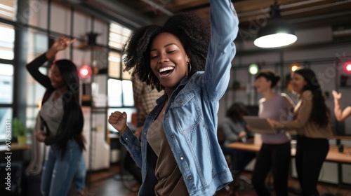 Dark women in the office dance with technology 