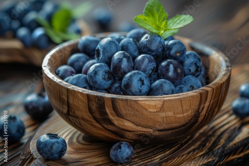 Wallpaper Mural Fresh blueberries in rustic wooden bowls, garnished with mint leaves, set on a wooden table, emphasizing a natural and wholesome look. Torontodigital.ca