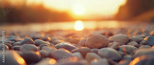 Stony Riverbank at Sunset With Glowing Reflections in Tranquil Waters