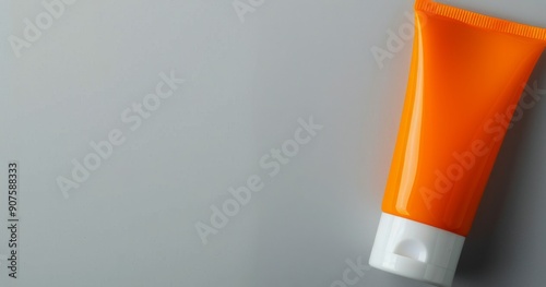 Bright Orange Moisturizing Cream and Jar on White Background