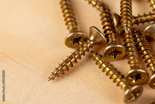 yellow metal self-tapping screws for fixing wooden boards and other wood products photo