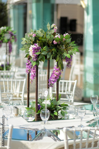 Beautifully Decorated Wedding Tables with Purple Flowers at Garden Event