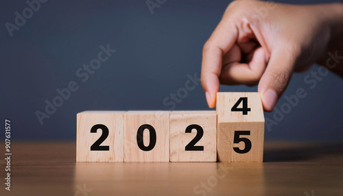 Wooden block with numbers 2024 and 2025, transitioning to 2024 and 2025. Business growth planning concept.