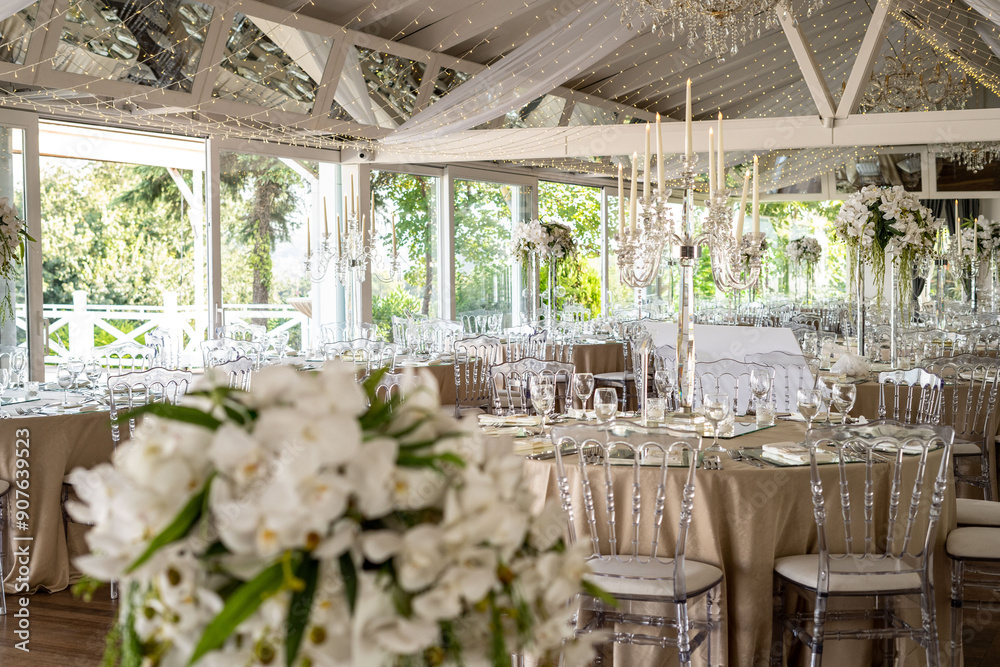 Indoor Wedding Reception: Round Tables with Unique Floral Centerpieces