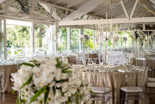 Indoor Wedding Reception: Round Tables with Unique Floral Centerpieces