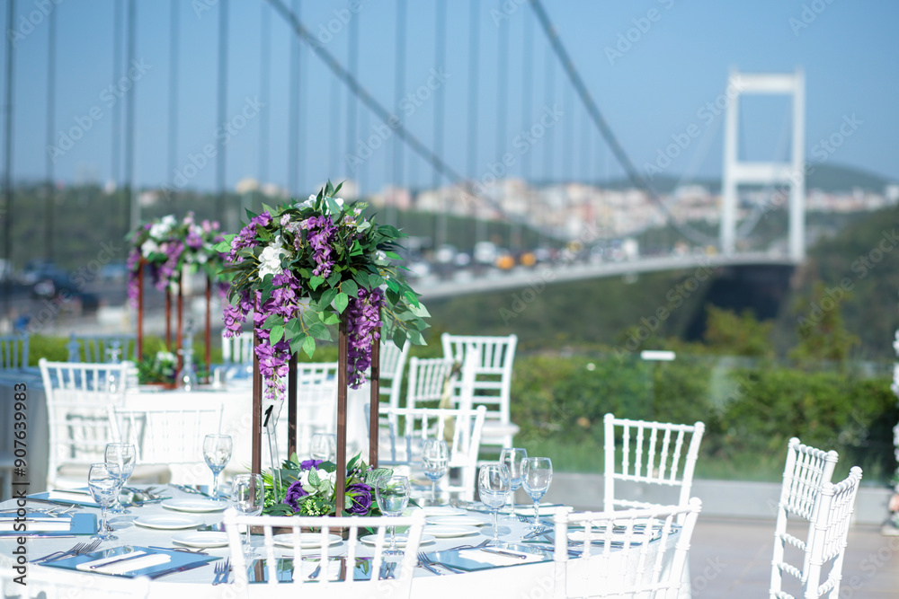 Elegant Outdoor Wedding Reception with Purple and White Floral Centerpieces