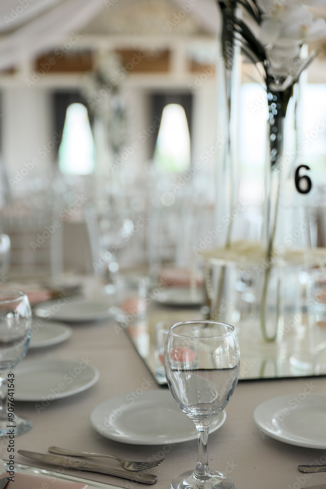 Indoor Wedding Reception: Round Tables with Unique Floral Centerpieces