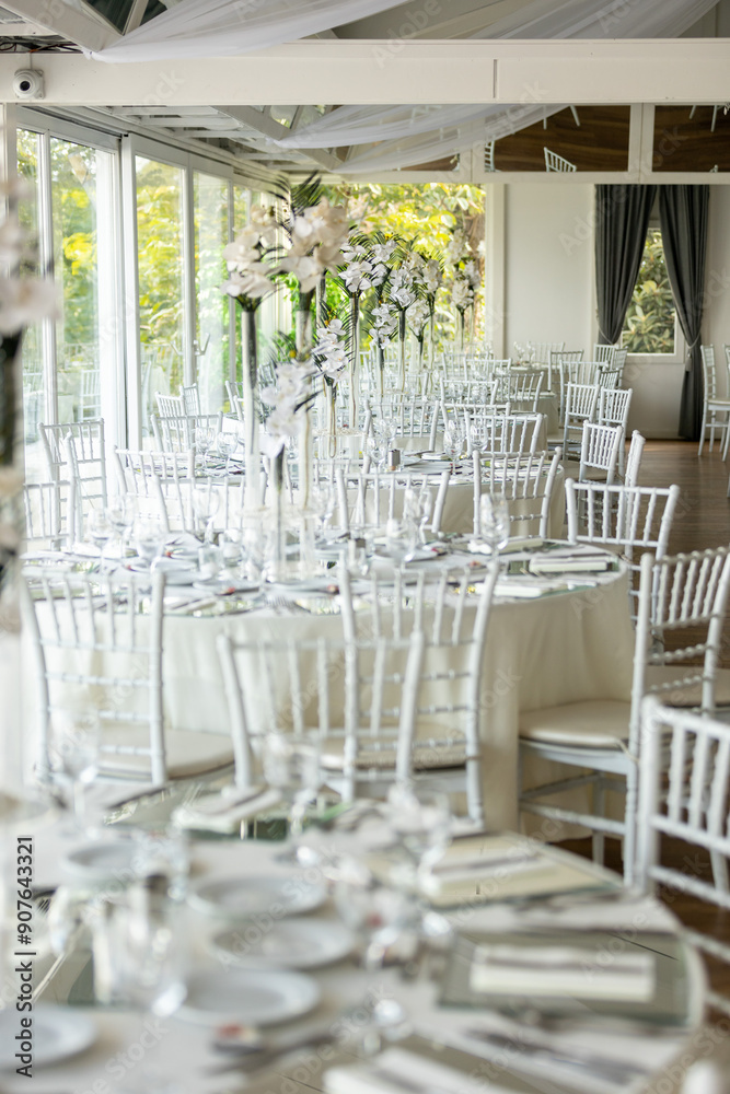 Indoor Wedding Reception: Round Tables with Unique Floral Centerpieces