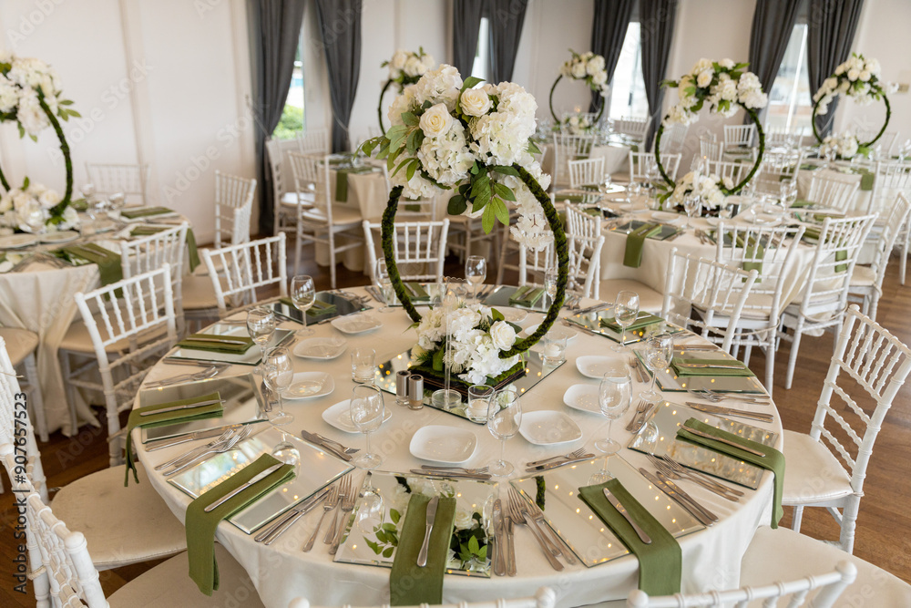 Indoor Wedding Reception: Round Tables with Unique Floral Centerpieces