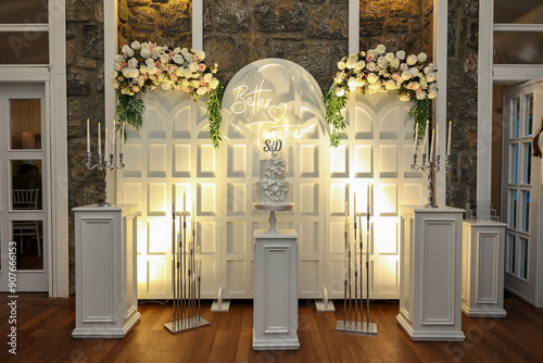 Obraz na płótnie Refined Wedding Cake Presentation with Flowers and Lighting Inside Venue w salonie