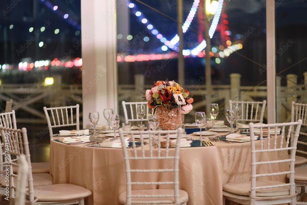 Elegant Wedding Table Setting with Sunflower Centerpiece and City Lights