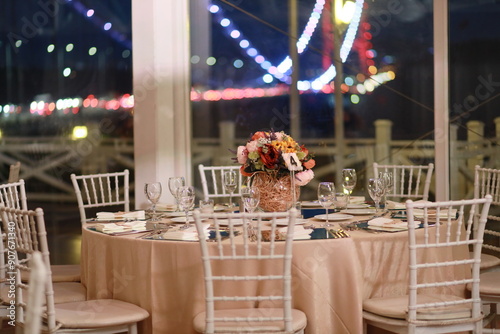 Elegant Wedding Table Setting with Sunflower Centerpiece and City Lights