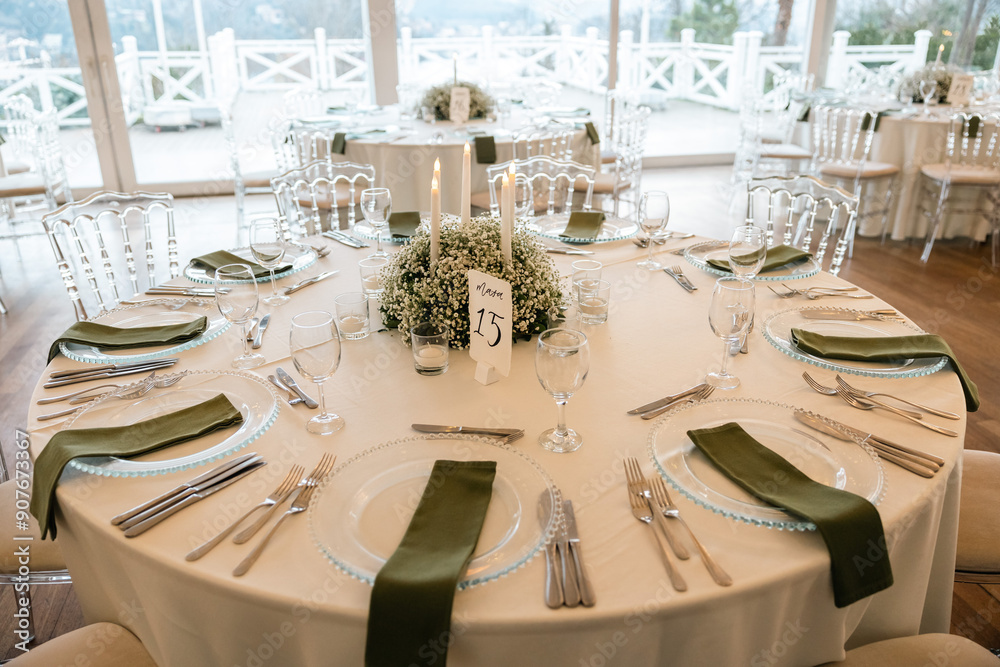 Romantic reception table with floral centerpiece and soft candlelight
