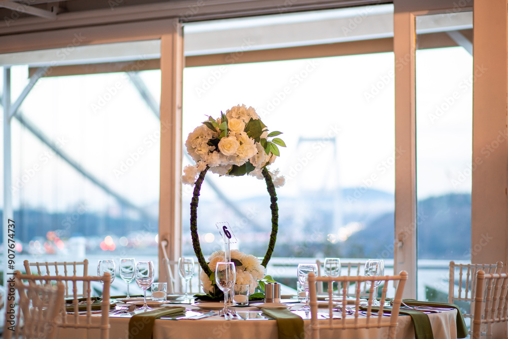 Luxurious dining arrangement near Bosphorus Bridge with white roses and modern decor